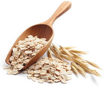 Oats in a small scooper. Oats in a small scooper.