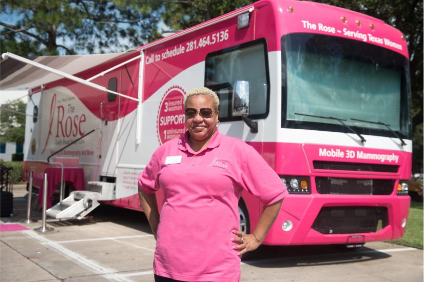 Woman standing in front of a bus. Woman standing in front of a bus.