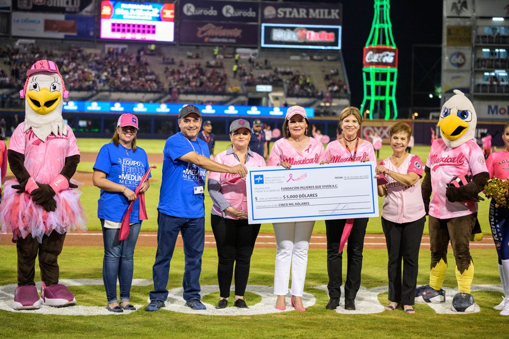 Medline employees presenting a giant check inside a baseball stadium. Medline employees presenting a giant check inside a baseball stadium.
