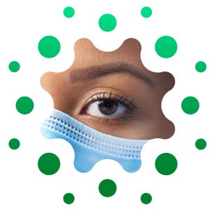 Close-up of female caregiver’s eye and top edge of a face mask, cropped in distinctive circular shape Close-up of female caregiver's eye and top edge of a face mask, cropped in distinctive circular shape