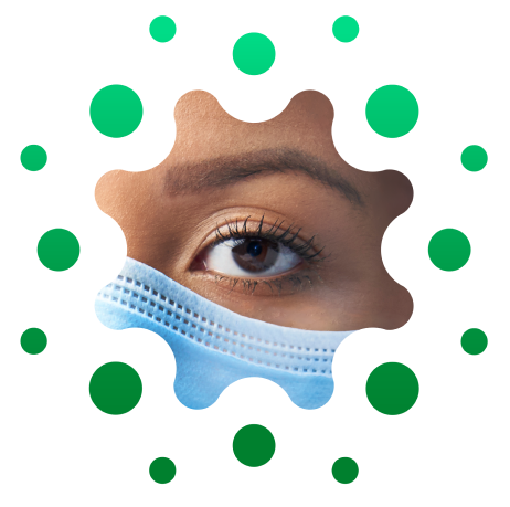 SYM_IP emblem_RGB 2 Close-up of a female caregiver's eye and the top edge of surgical mask below her eye, cropped in distinctive circular shape