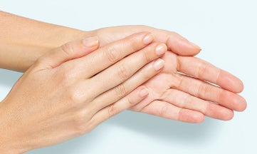 STK_Spectrum Hands Spread_036 1 Clinician rubbing her hands with hand sanitizer