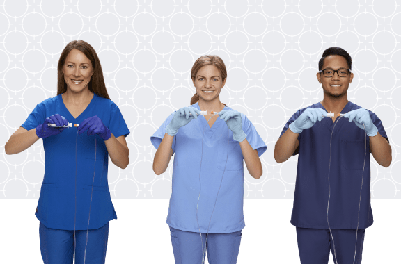 empower-1 (1)-min Three clinicians in scrubs, each holding a saline flush syringe and disinfection cap with patterned background