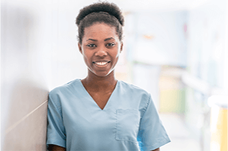 Nurse-Leadership Woman in light blue scrubs smiling