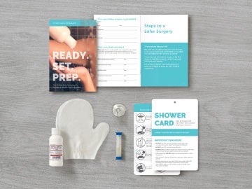 Neatly arranged contents of pre-surgery kit with bottle of CHG cleanser, shower mitt, sand-timer and instructions Illustration of grey invoice with blue dollar sign and white percent sign in blue magnifying glass to show saving money