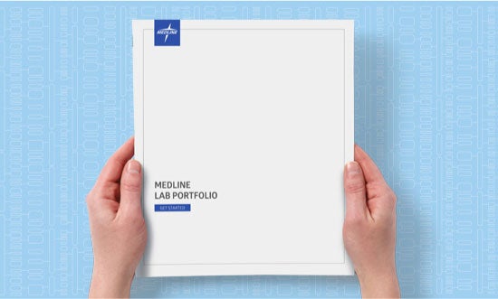 Request-catalog Hands holding a copy of the Medline Lab Portfolio catalog