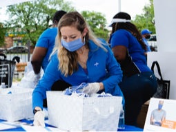 Masked Medline employees volunteering at a community outreach event